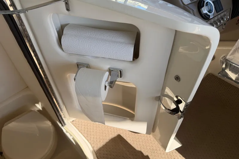 Slide: The Image of Interior of a 2013 Sea Ray 300 SLX boat with paper towel and toilet paper holders. - 41