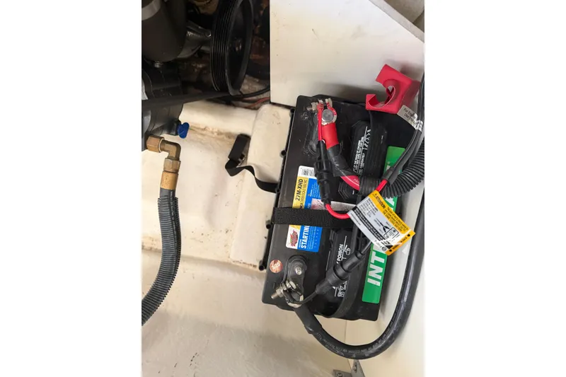 Slide: The Image of Battery compartment of a 2013 Sea Ray 300 SLX boat, showing wiring and connections. - 46