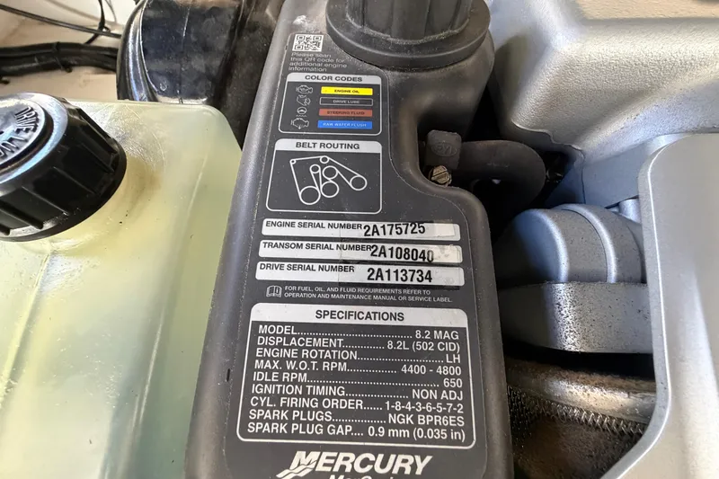 Slide: The Image of Engine specifications label on a 2013 Sea Ray 300 SLX boat. - 49