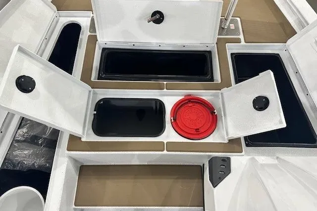 Slide: The Image of 2026 Xpress H18C Crappie boat storage compartments with open lids and red circular hatch. - 4