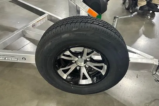 Slide: The Image of Trailer wheel of 2026 Xpress H18C Crappie boat on display. - 7