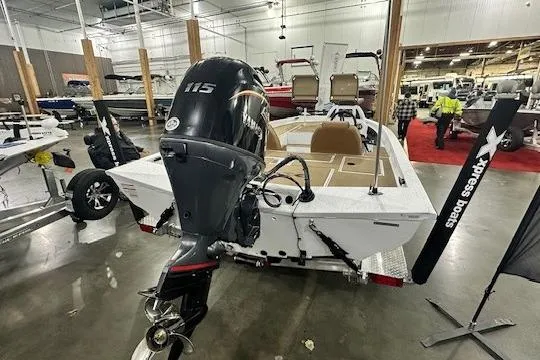 Slide: The Image of 2026 Xpress H18C Crappie boat with 115 HP engine displayed indoors. - 8