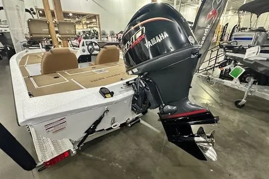Slide: The Image of 2026 Xpress H18C Crappie boat with Yamaha motor in showroom setting. - 9