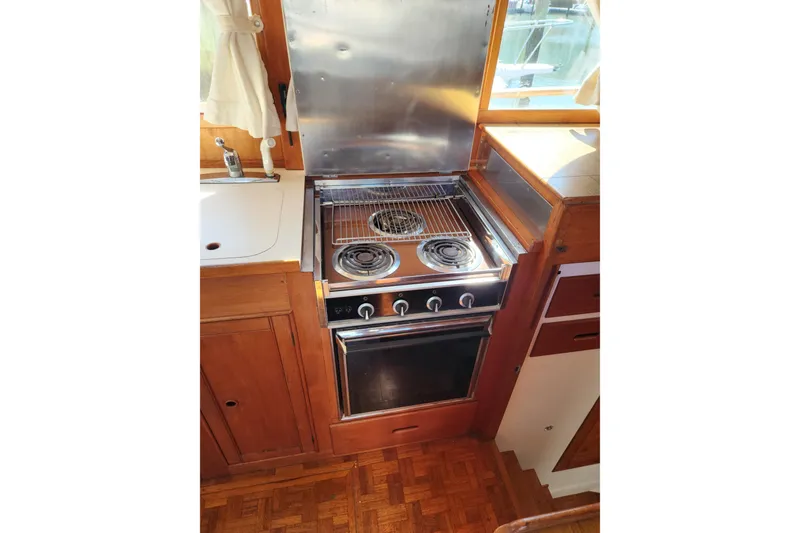 Slide: The Image of Galley kitchen in 1983 Grand Banks 36 Classic boat with stove and sink. - 12