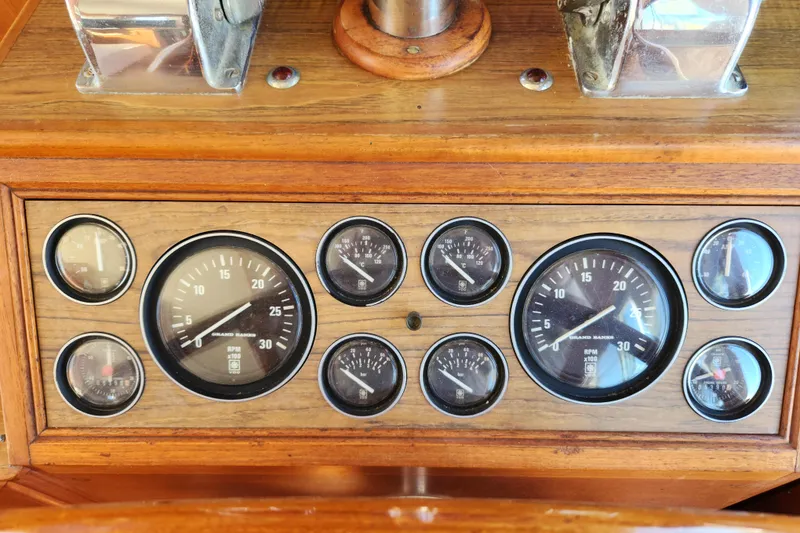 Slide: The Image of Dashboard of 1983 Grand Banks 36 Classic boat with gauges and controls. - 14