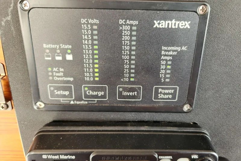 Slide: The Image of Control panel of a 1983 Grand Banks 36 Classic boat, displaying battery and power settings. - 20
