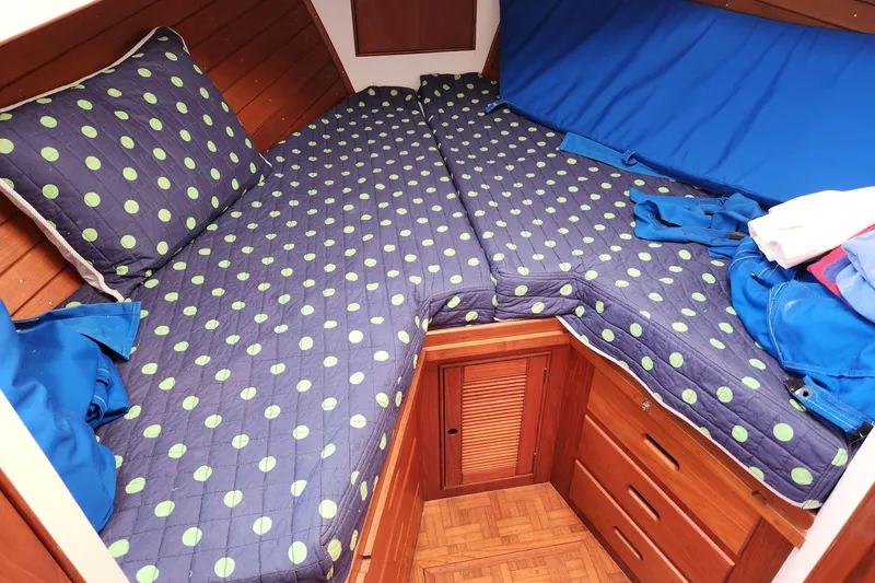 Slide: The Image of Cozy cabin interior of 1983 Grand Banks 36 Classic with polka dot bedding. - 23