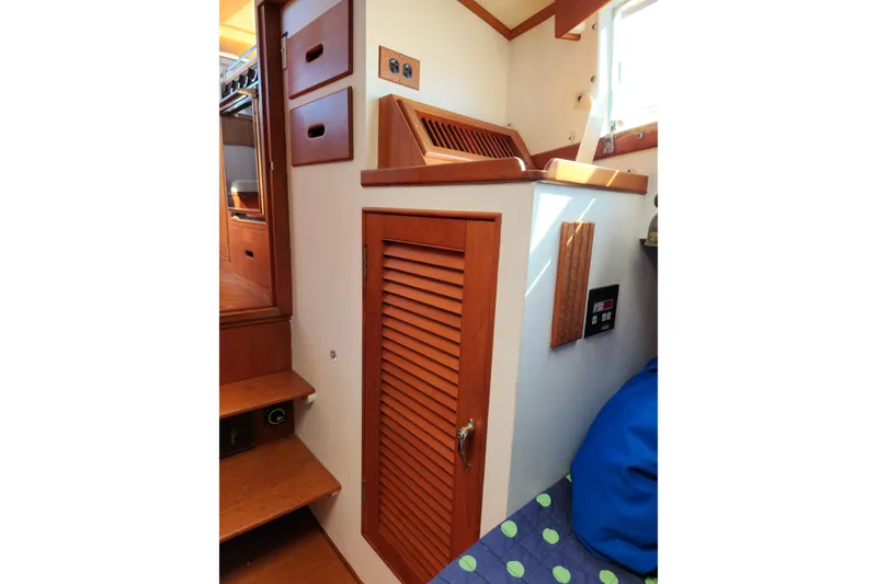 Slide: The Image of Interior of 1983 Grand Banks 36 Classic yacht with wooden cabinetry and stairs. - 24