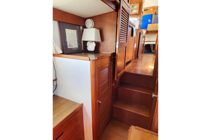 Slide: The Image of Interior of 1983 Grand Banks 36 Classic yacht with wooden stairs and cabinetry. - 26