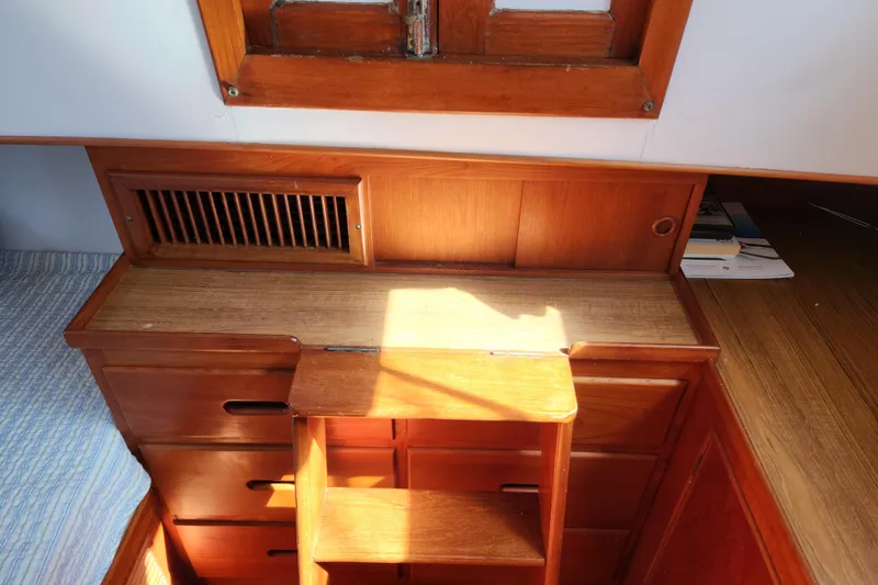 Slide: The Image of Interior of 1983 Grand Banks 36 Classic with wooden cabinetry and window. - 28