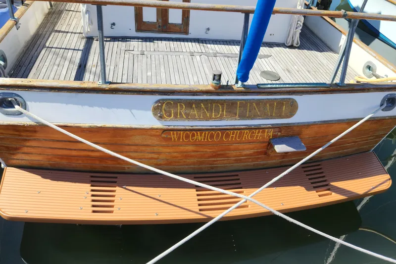 Slide: The Image of 1983 Grand Banks 36 Classic boat named "Grande Finale" docked, wooden deck visible. - 3