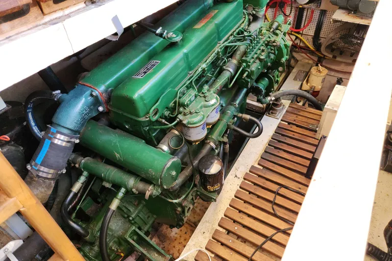 Slide: The Image of Engine room of 1983 Grand Banks 36 Classic with green marine engine. - 30