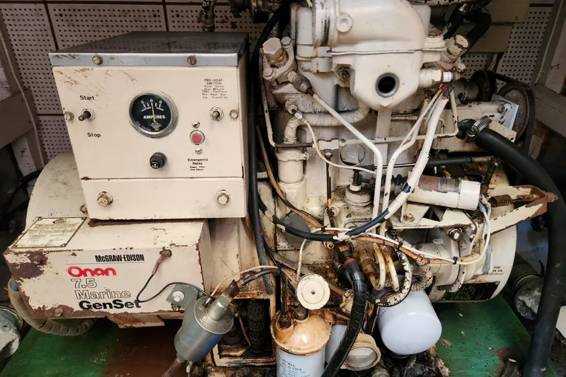 Slide: The Image of 1983 Grand Banks 36 Classic engine room with Onan 7.5 Marine GenSet generator. - 32