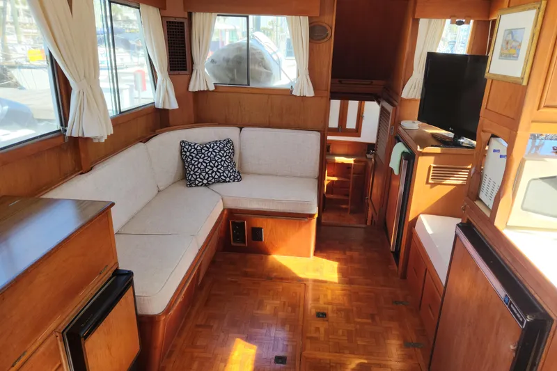 Slide: The Image of Interior of 1983 Grand Banks 36 Classic yacht with cozy seating and wooden finishes. - 5