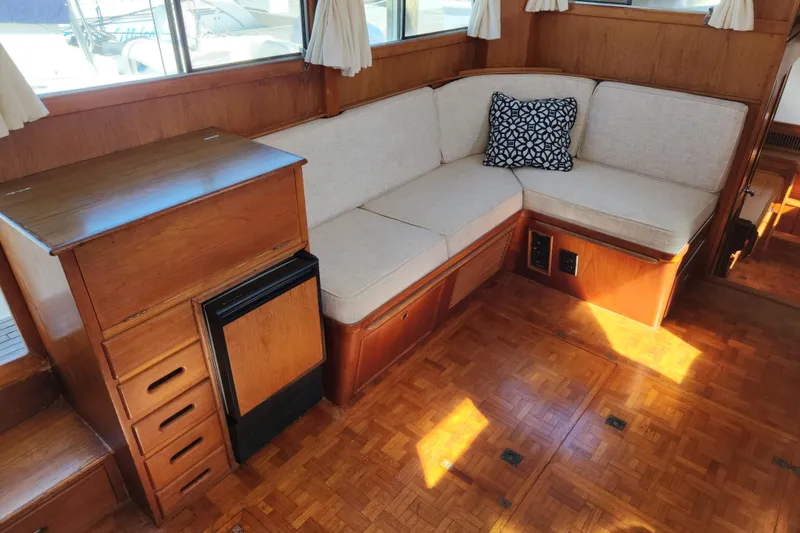 Slide: The Image of Interior of 1983 Grand Banks 36 Classic yacht with wooden cabinetry and cushioned seating. - 6