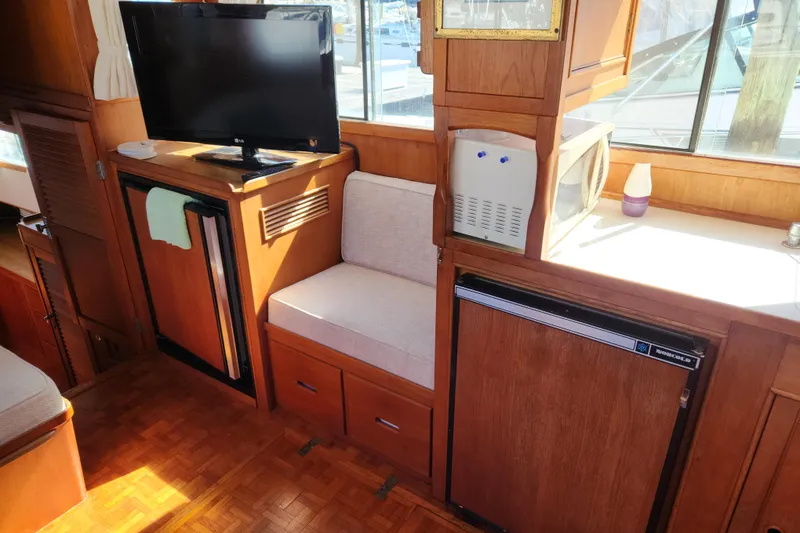 Slide: The Image of Interior of 1983 Grand Banks 36 Classic with TV, fridge, and microwave. - 7