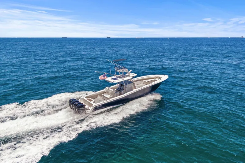 The Image of 2013 Invincible 42 Open Fisherman cruising on the ocean. - 0