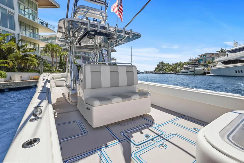 Slide: The Image of Aerial view of 2013 Invincible 42 Open Fisherman boat cruising on blue ocean waters. - 15