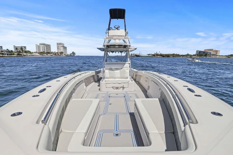 Slide: The Image of 2013 Invincible 42 Open Fisherman boat dashboard with ocean view. - 31