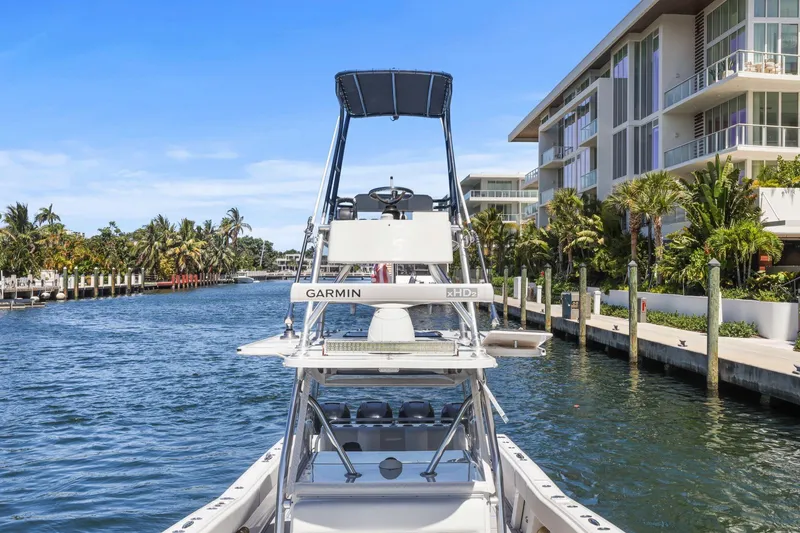 Slide: The Image of Cockpit view of 2013 Invincible 42 Open Fisherman boat on open sea. - 32