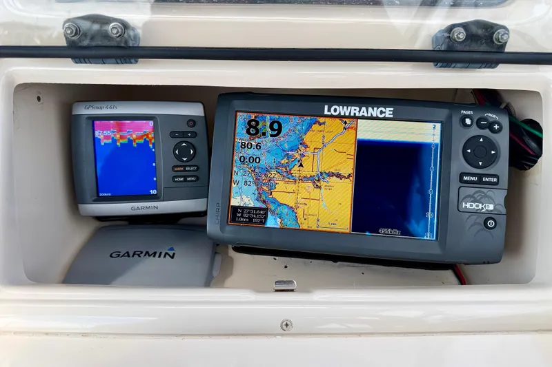 Slide: The Image of Boat navigation system with Garmin and Lowrance displays on a 2006 Grady-White Adventure 208. - 15