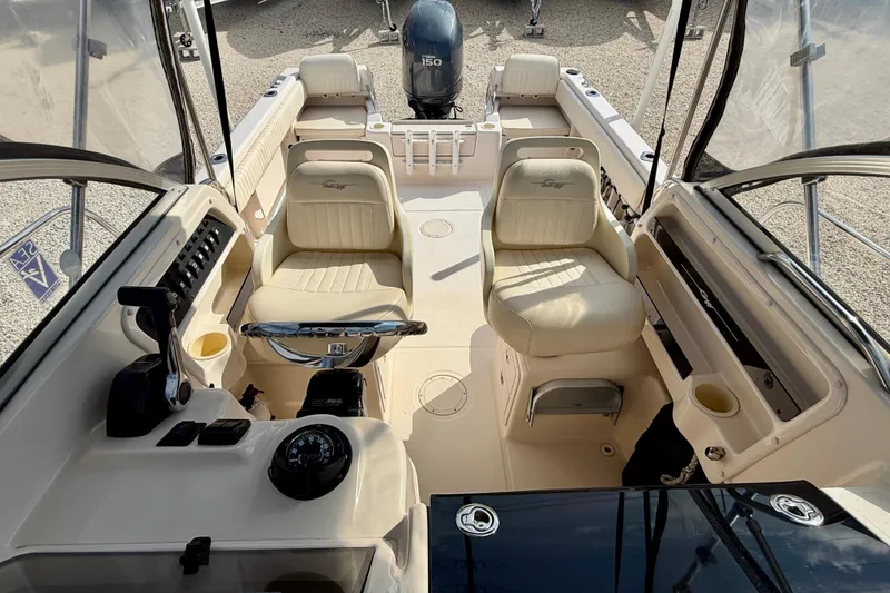 Slide: The Image of 2006 Grady-White Adventure 208 boat interior with helm, seating, and controls. - 20