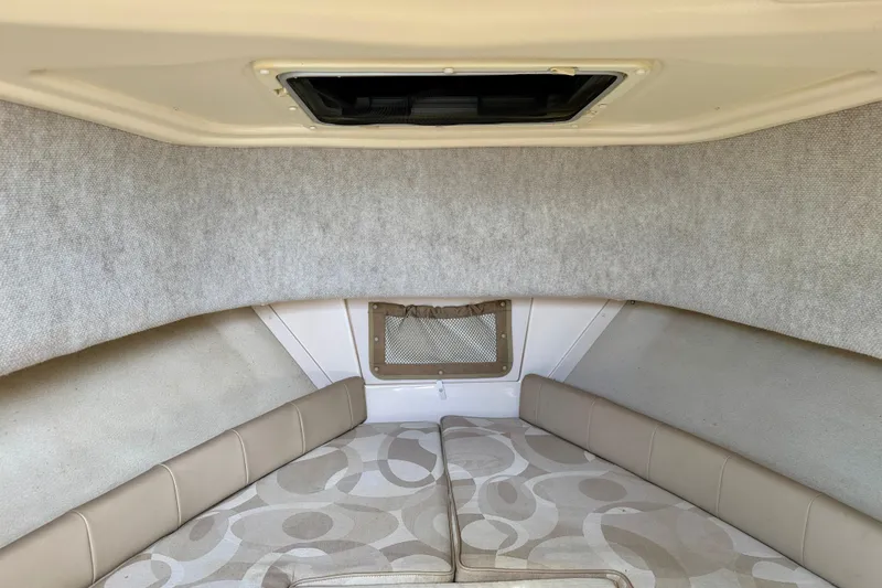 Slide: The Image of 2006 Grady-White Adventure 208 cabin interior with cushioned seating and overhead hatch. - 29