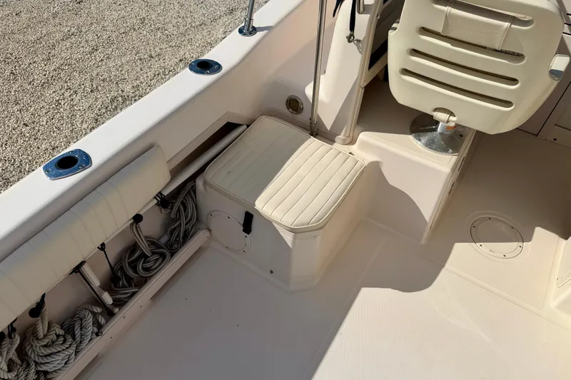 Slide: The Image of 2006 Grady-White Adventure 208 boat interior with seating and storage compartments. - 30