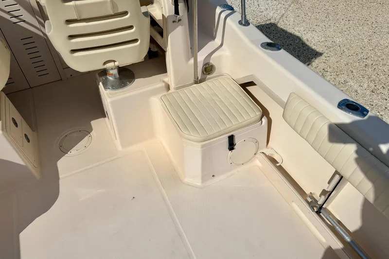 Slide: The Image of 2006 Grady-White Adventure 208 boat interior with seating and storage. - 32