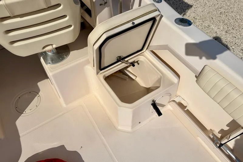 Slide: The Image of 2006 Grady-White Adventure 208 boat interior with open storage compartment. - 33