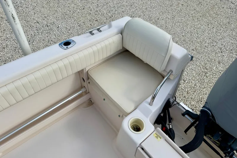 Slide: The Image of 2006 Grady-White Adventure 208 boat interior with cushioned seating and rod holder. - 36