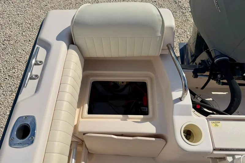 Slide: The Image of 2006 Grady-White Adventure 208 boat interior with open storage compartment. - 38