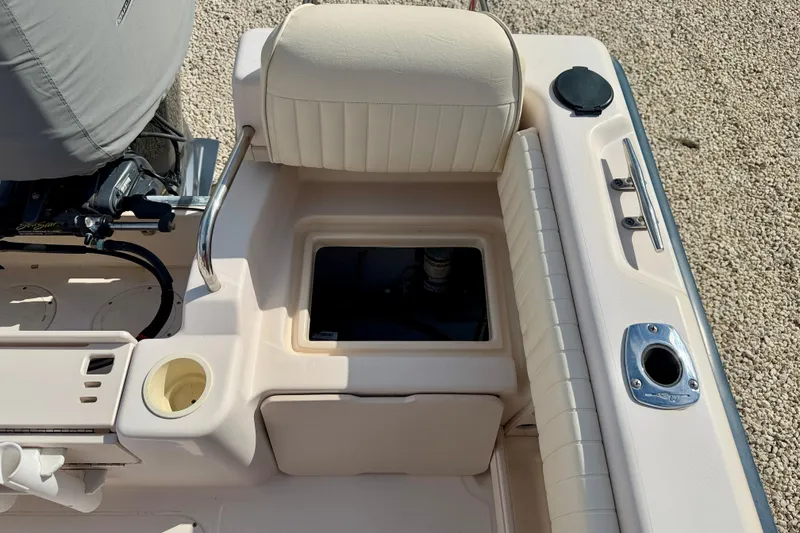 Slide: The Image of 2006 Grady-White Adventure 208 boat interior with seating and storage compartments. - 40