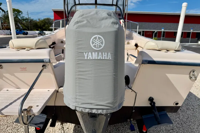 Slide: The Image of 2006 Grady-White Adventure 208 boat with Yamaha engine cover, parked outdoors. - 43