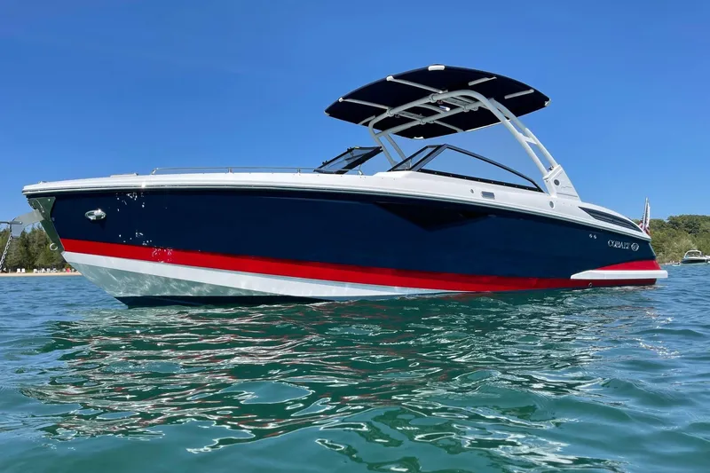 The Image of 2021 Cobalt A29 boat on clear blue water under a sunny sky. - 0