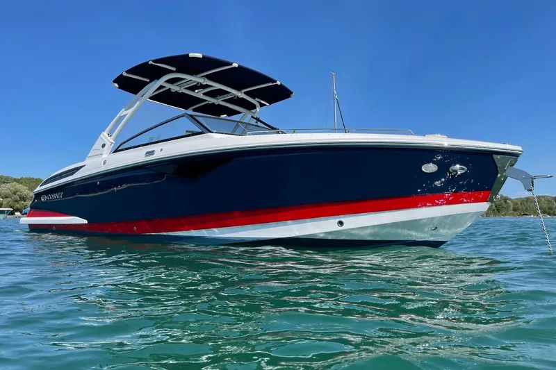 Slide: The Image of 2021 Cobalt A29 boat on clear blue water under a sunny sky. - 3