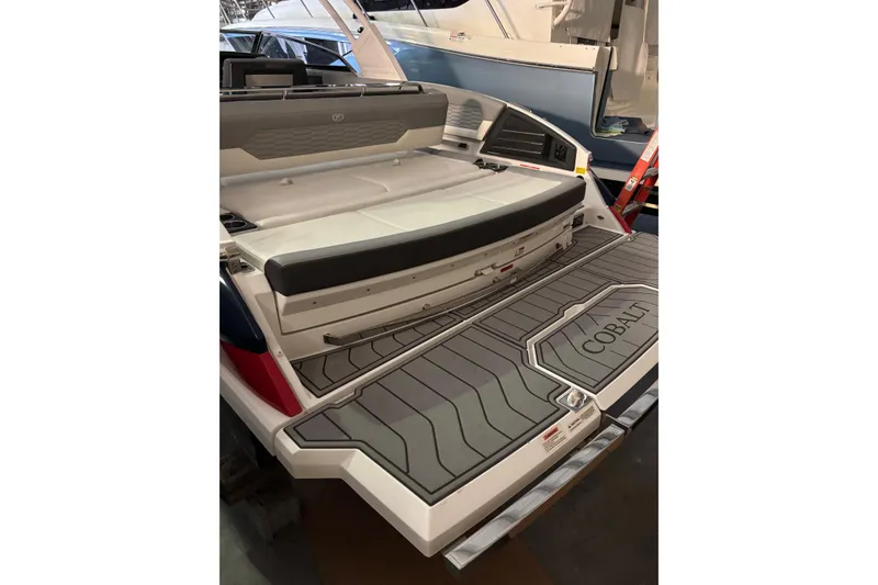 Slide: The Image of 2021 Cobalt A29 boat interior with seating and branded flooring. - 6