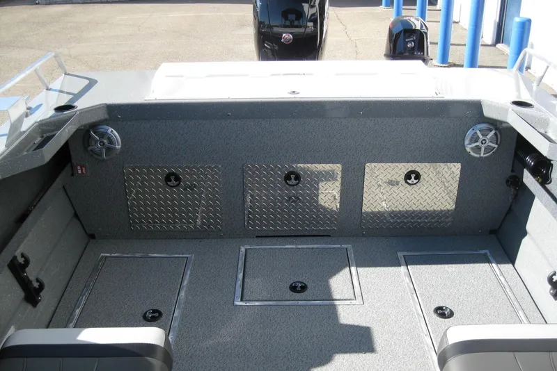 Slide: The Image of 2026 Lund 185 Heavy Gauge boat interior with cushioned seating and steering console. - 10