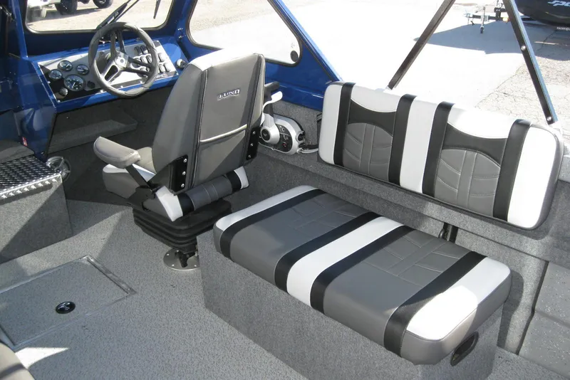Slide: The Image of 2026 Lund 185 Heavy Gauge boat interior with stylish seating and modern design. - 16