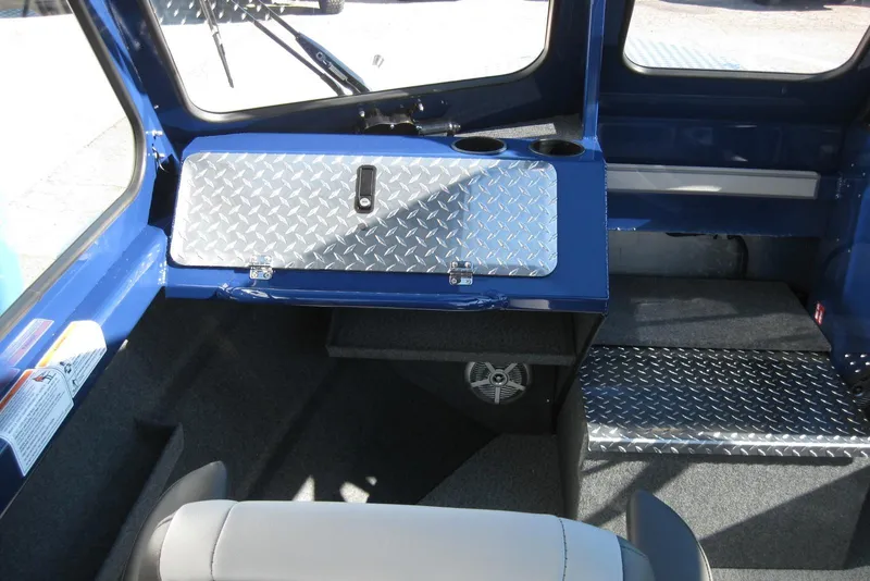 Slide: The Image of 2026 Lund 185 Heavy Gauge boat interior with modern seating and steering console. - 17