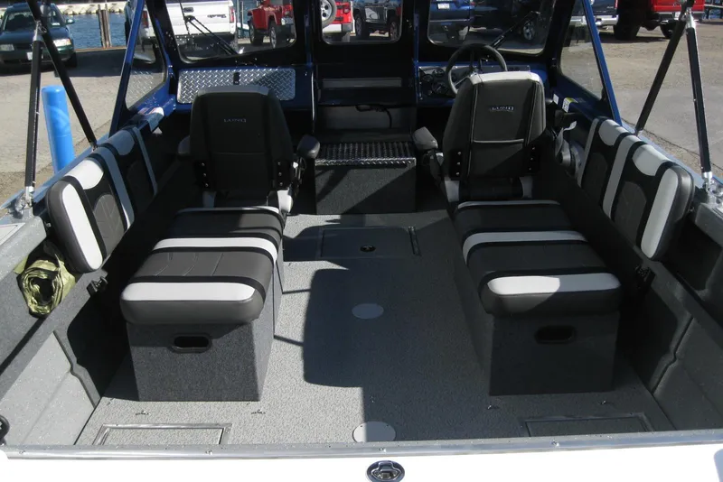 Slide: The Image of 2026 Lund 185 Heavy Gauge boat with diamond plate aluminum deck detail. - 9