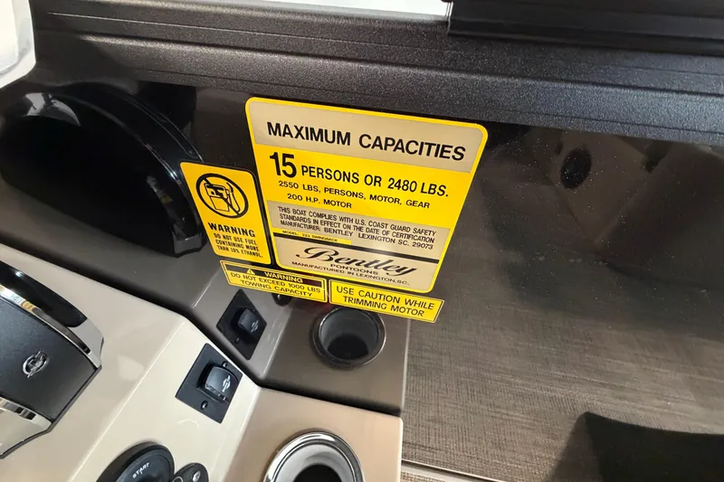 Slide: The Image of 2026 Bentley Pontoons Legacy 223 Swingback capacity label, 15 persons or 2480 lbs, 200 HP motor. - 11
