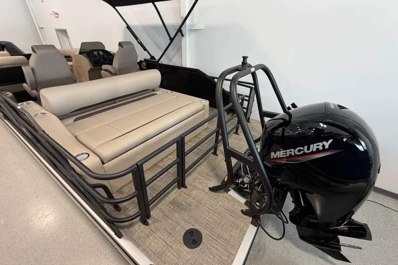 Slide: The Image of 2026 Bentley Pontoons Legacy 223 Swingback with Mercury outboard engine, beige seating, and modern design. - 4
