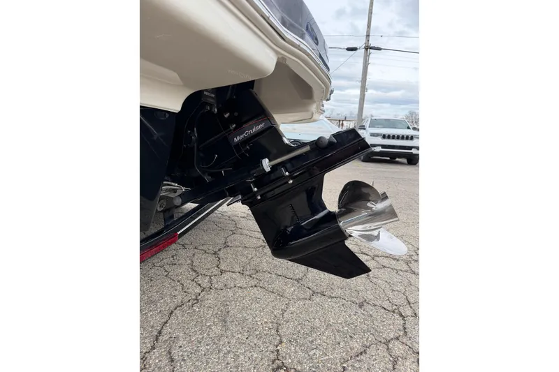 Slide: The Image of 2014 Chaparral 206 SSi boat with MerCruiser outdrive on pavement. - 15