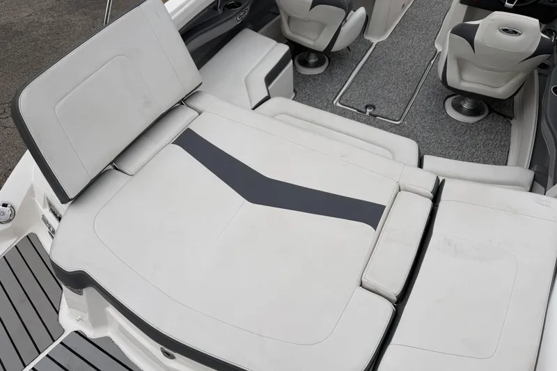Slide: The Image of 2014 Chaparral 206 SSi boat interior with cushioned seating and carpeted flooring. - 18