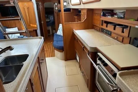 Slide: The Image of Interior of 2005 Island Packet 445 yacht featuring a modern kitchen. - 16