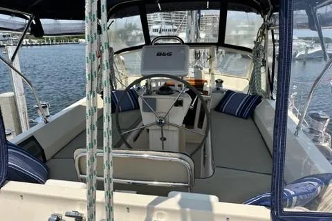 Slide: The Image of Interior view of 2005 Island Packet 445 sailboat with steering wheel and seating area. - 30