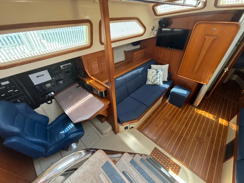Slide: The Image of Interior of a 2005 Island Packet 445 yacht with blue seating. - 4