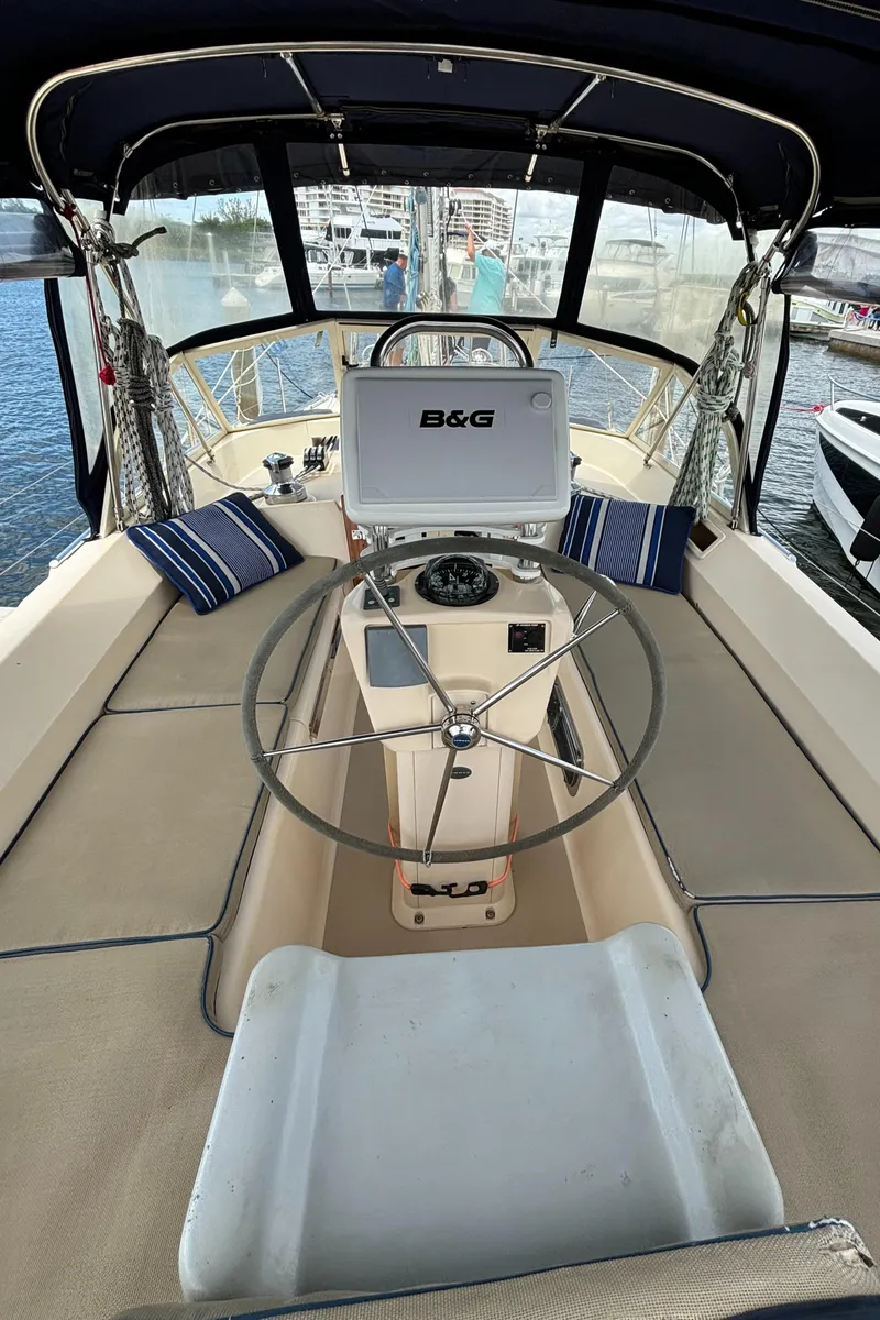 Slide: The Image of 2005 Island Packet 445 yacht cockpit with steering wheel and navigation system. - 42