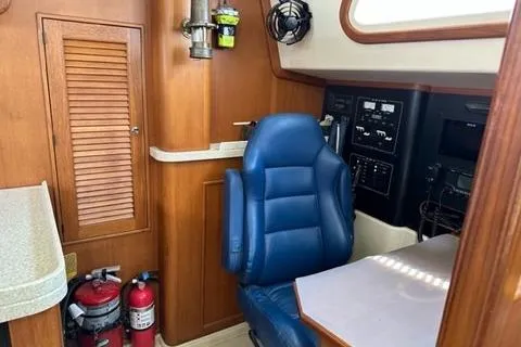 Slide: The Image of Interior of a 2005 Island Packet 445 yacht with blue captain's chair. - 8
